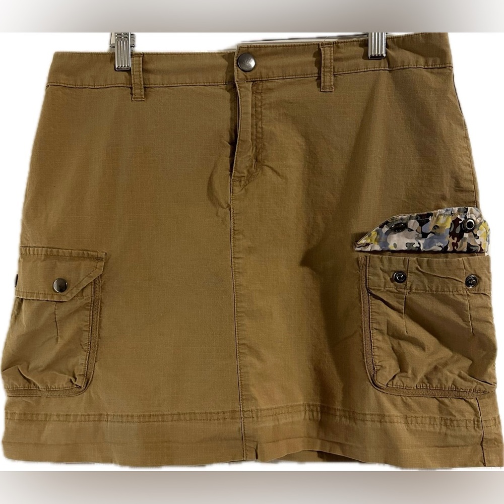 Columbia tan skirt with flower/camoflague accents, heavy metals buttons, pockets